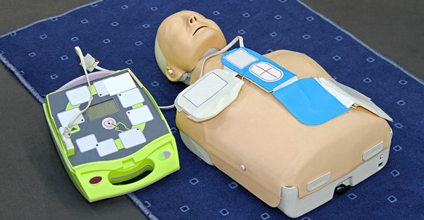 a mannequin connected to a defibrillator