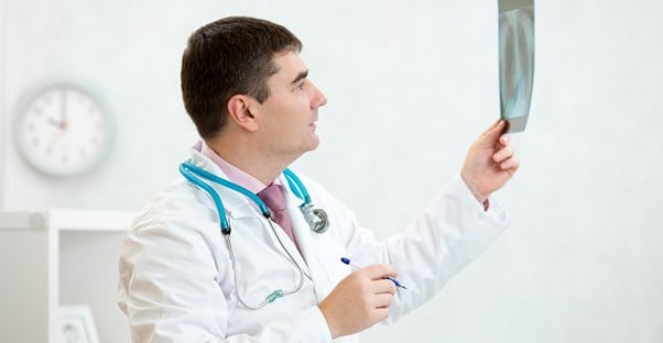 A doctor examines a mucus plug reading