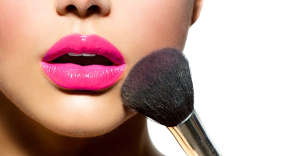 Image of a woman with hot pink lipstick applying bright blush and realizing it isn't make up to wear on a date.