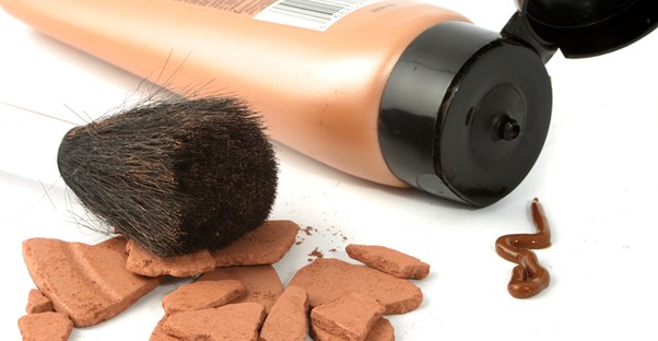 a tube of self-tanner and other makeup products