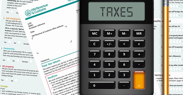 Photo of a calculator and accounting forms