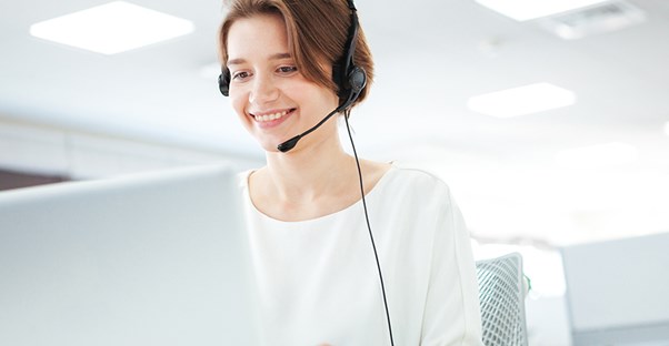 a picture of a woman working as an operator at a call center