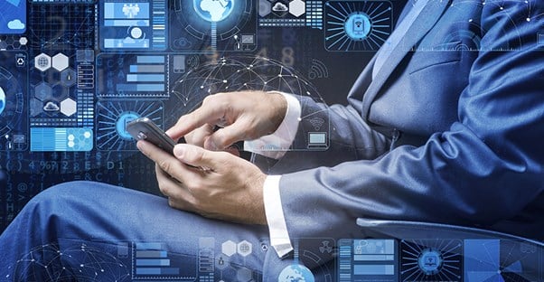 a man in a suit touching his cell phone with data concept images in the background