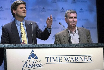 America Online Chairman Steve Case and Time Warner Chairman Gerald Levin announce their companies' merger in January 2000 at a New York news conference.
