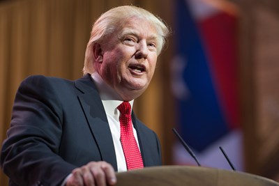 Donald trump standing at a podium