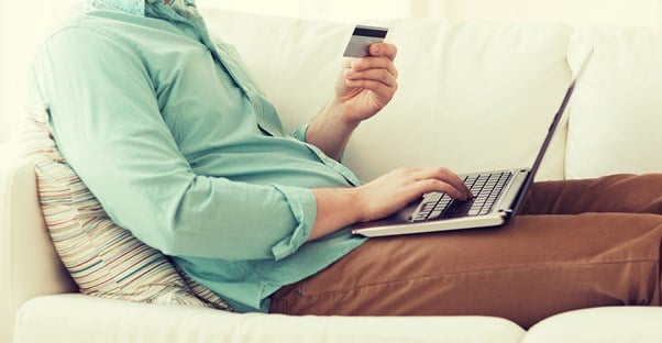 man making an online purchase from his computer