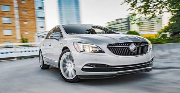 a buick lacrosse cruising the city streets