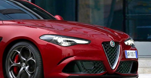 a red 2018 alfa romeo giulia front grill and headlights