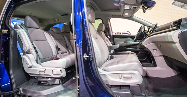 the front and side sliding door of a 2019 honda odyssey open to show the interior cabin