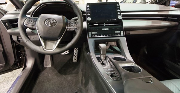 the interior of a 2019 toyota avalon showing the steering wheel and center console
