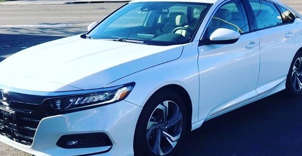 a white 2019 honda accord parked in a parking lot