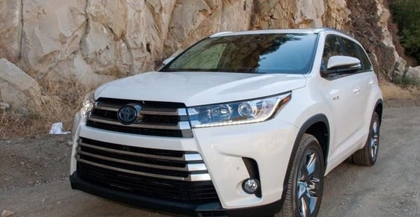 a white 2019 toyota highlander in an off road setting