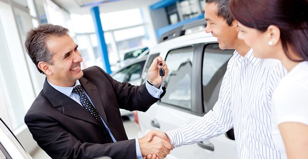 a customer haggling with a salesperson over a new car