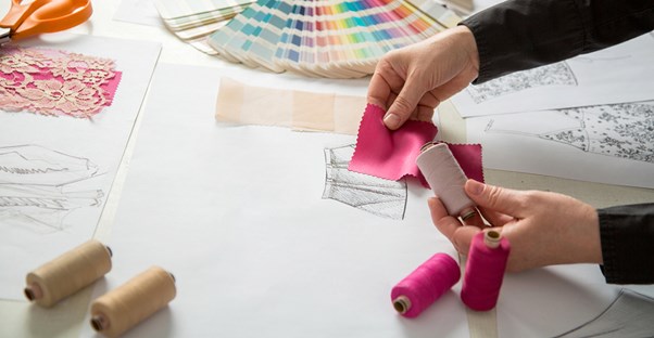 Fashion designer tests colors and fabric for potential designs