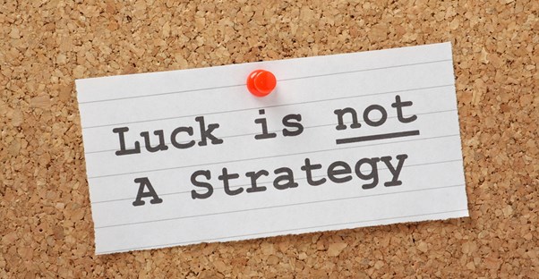Sticky note that says Luck is not a strategy