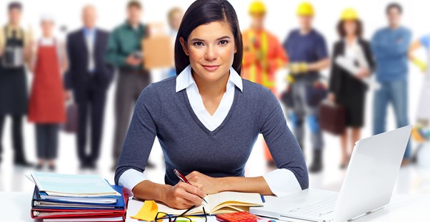 A girl doing paperwork smiles as people with different occupations stand in the background