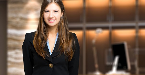 An administrative assistant assists a customer