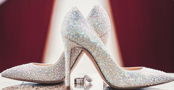 Standard wedding picture of the brides shoes and the rings