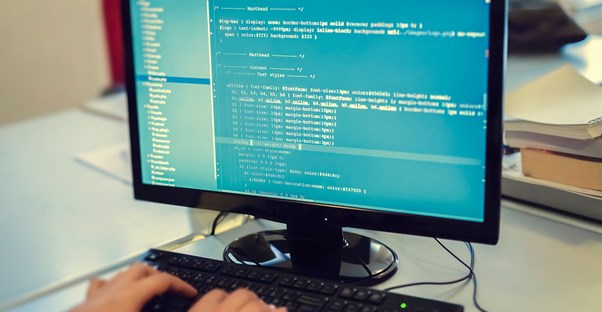 A developer writes code on a computer