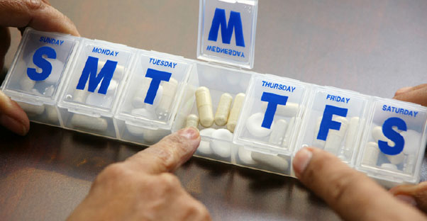 a weekly pill container holds shingles medication
