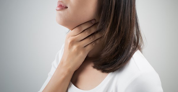 A woman needs treatment for throat cancer