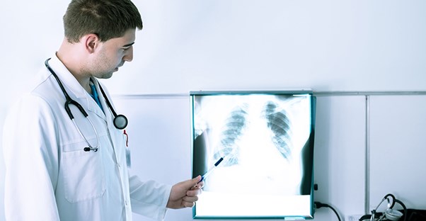 A doctor examines a popcorn lung