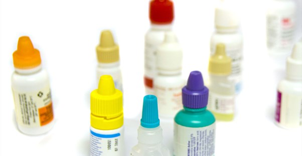 an array of different colored bottles of eye drops for dry eyes