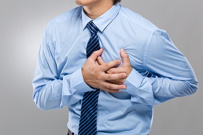 A man experiences heartburn