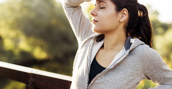 woman experiencing fatigue after a run