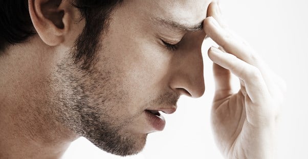 a man experiencing migraine headaches
