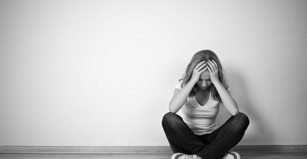 a woman contemplates bipolar treatments