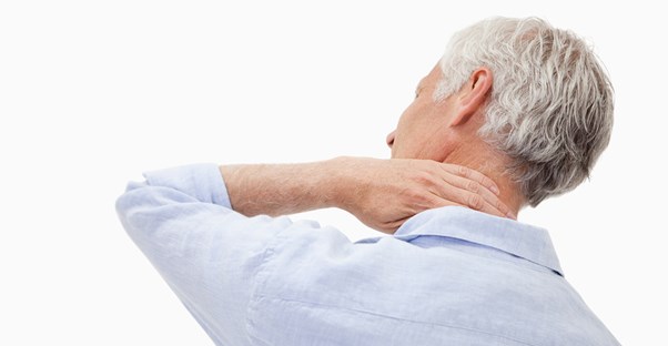 a man with chronic pain holds his neck