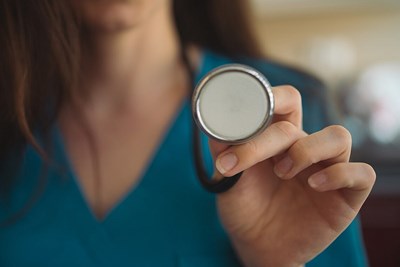 a nurse about to listen to the heart for an aortic dissection