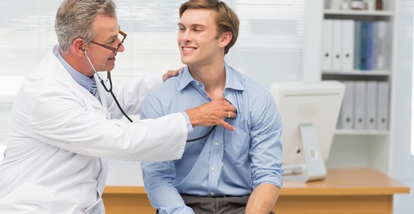 a doctor talking to a patient about gynecomastia prevention