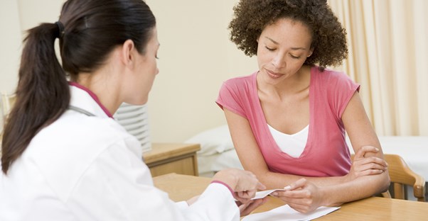 a doctor telling a patient about HPV risk factors