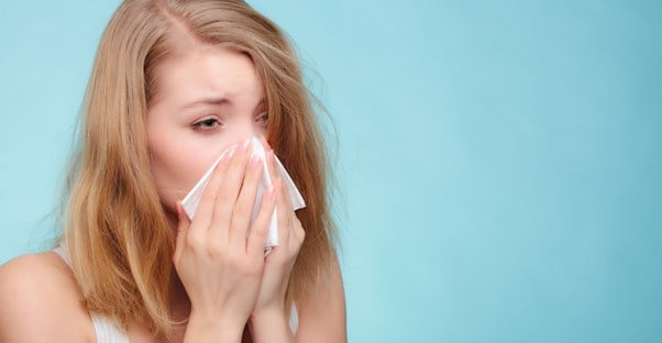 a woman suffering from sinusitis symptoms
