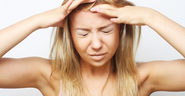 a woman experiencing cluster headaches