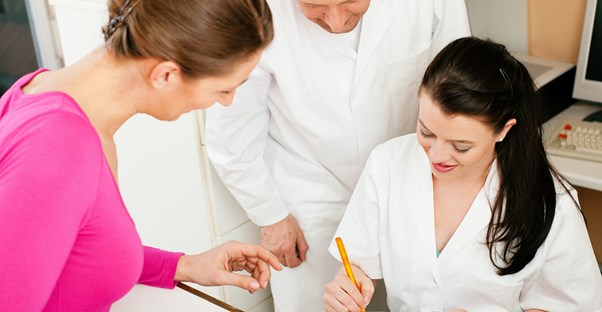 a doctor explains information about CML with a patient