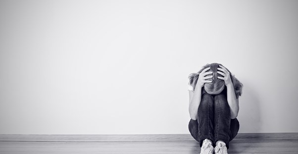 a woman experiencing clinical depression symptoms