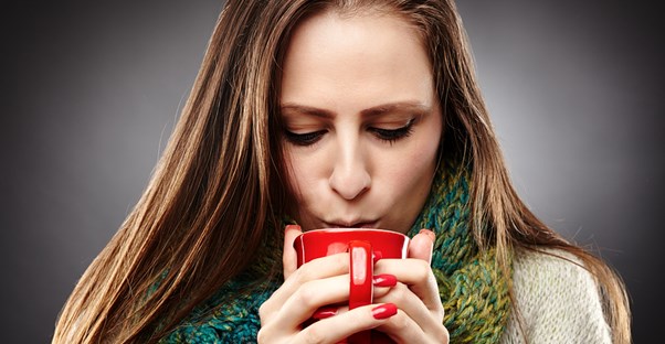 A woman contemplates the common causes of a sore throat