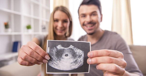 A couple with an ultrasound picture
