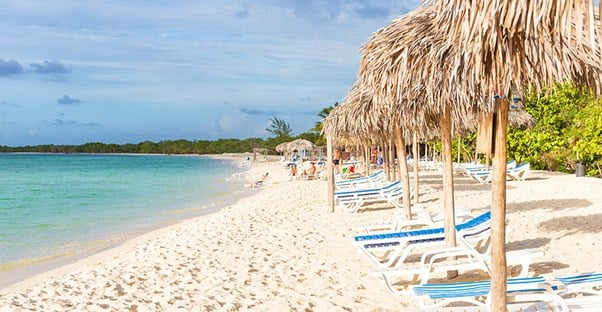 Resort chairs line the beach on Cayo Coco island in Cuba.