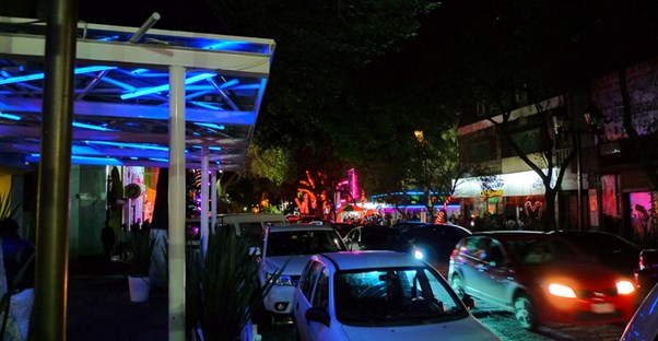 The lively clubs of the Zona Rosa district in Mexico City are lit up in colorful lights.