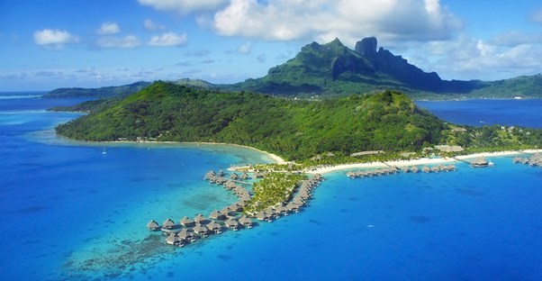 a panoramic shot of overwater bungalos on the island of Bora Bora