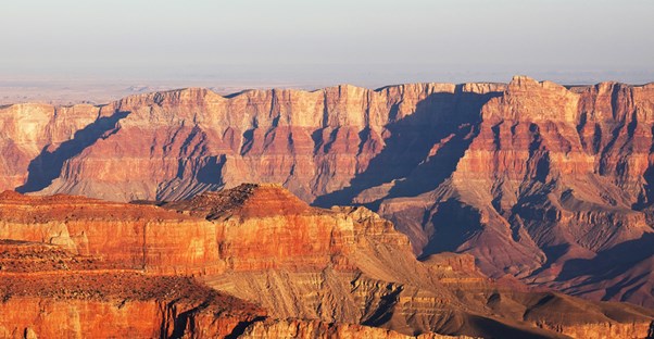 a landscape view of the Grand Canyon and its striped walls