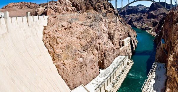 a view down the front of the hoover dam where water exits the generators