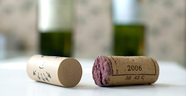 wine corks sit on the table of a romantic setting in a napa valley hotel