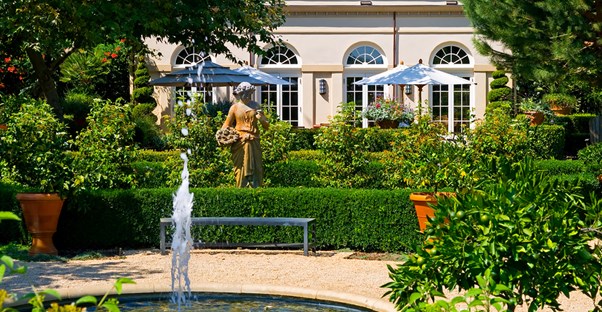 a lush fountain in the courtyard of a luxurious napa valley hotel