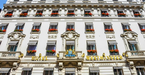 the many windows on the facade of a paris hotel