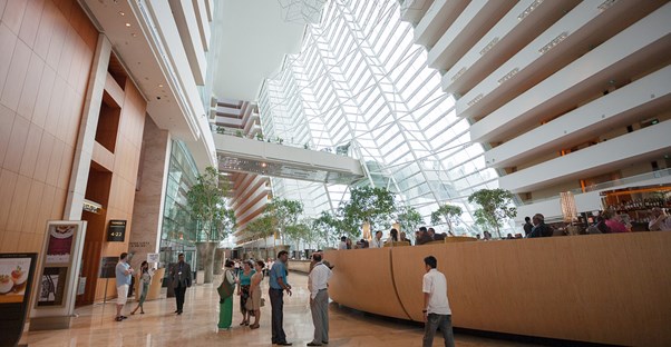 a large expansive atrium inside one of singapore's many hotels
